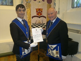 W Bro Bob Tomlin presents W Bro Derek Furminger with his 50 year certificate